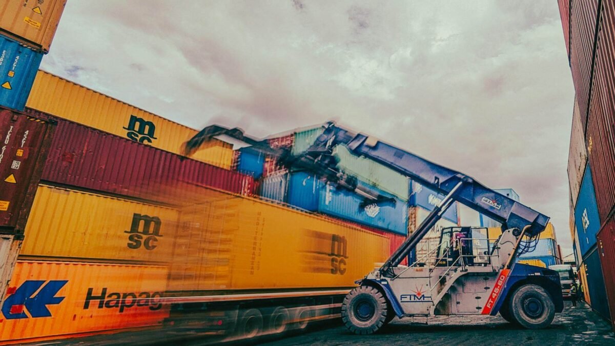Container Yard with Crane Moving Shipping Containers